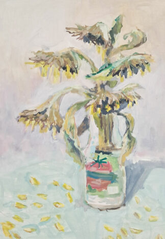 Bouquet de tournesol dans bouteille de tomates